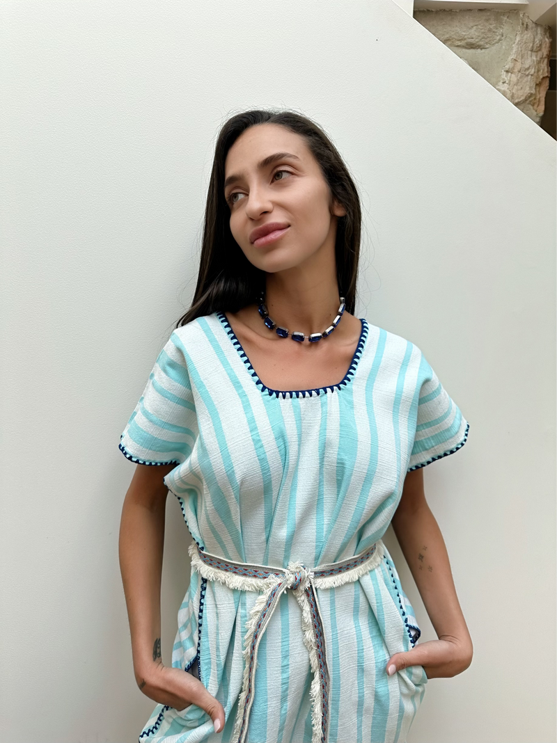 Short handmade cotton kaftan White with blue stripe with blue embroidery styled with belt front close