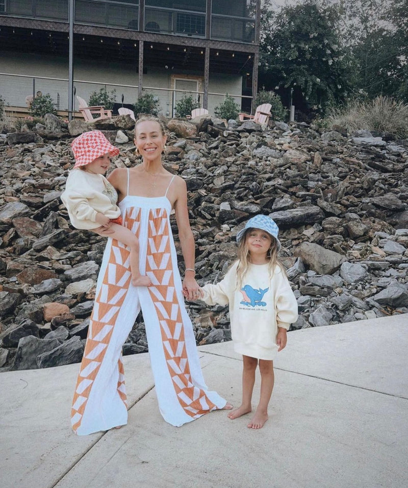 Cotton jumpsuit in white with geometric tan pattern influencer