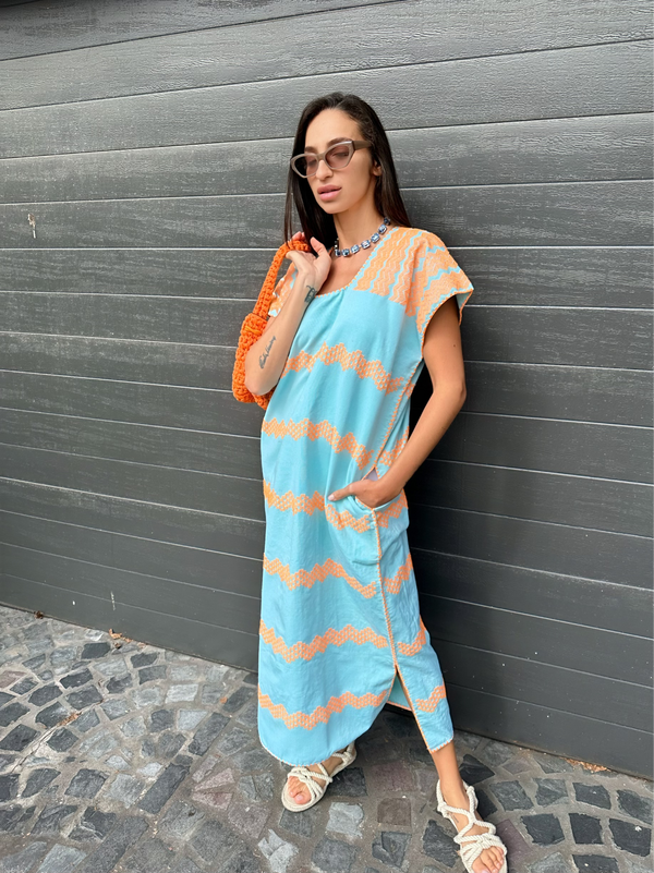 Long handmade cotton kaftan blue with orange embroidery styled without belt front wide with pockets