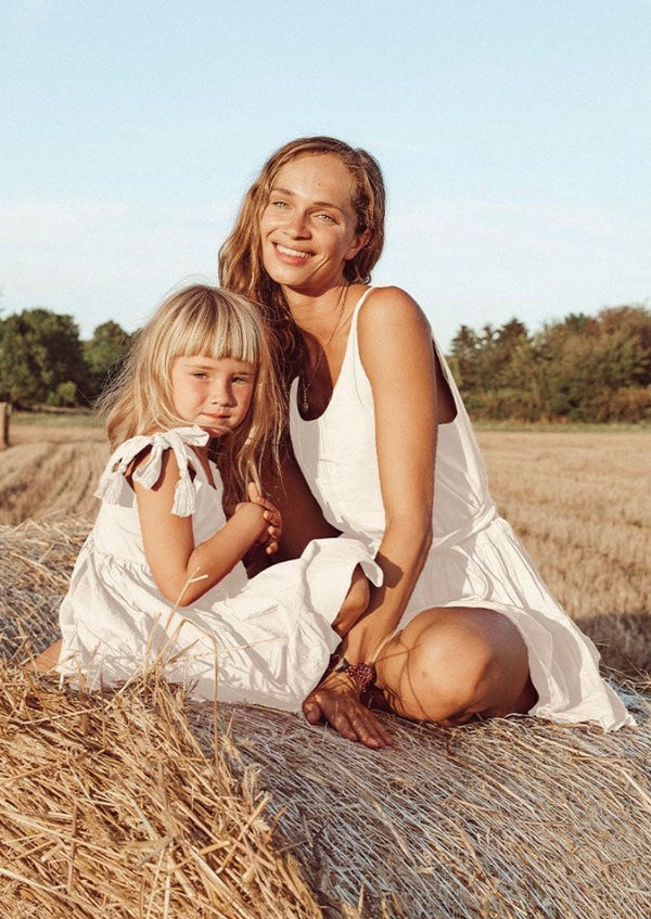 White relaxed sleeveless romper campaign image