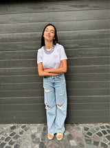 Blue STACKABLE NECKLACE styled with white t-shirt front wide